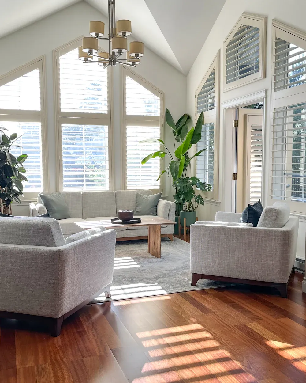Sunlight pouring through freshly cleaned windows into a bright Toronto living room