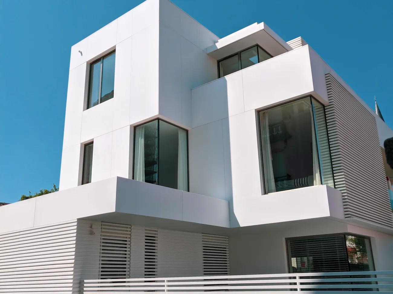 Spotless windows on a modern Toronto home under blue sky